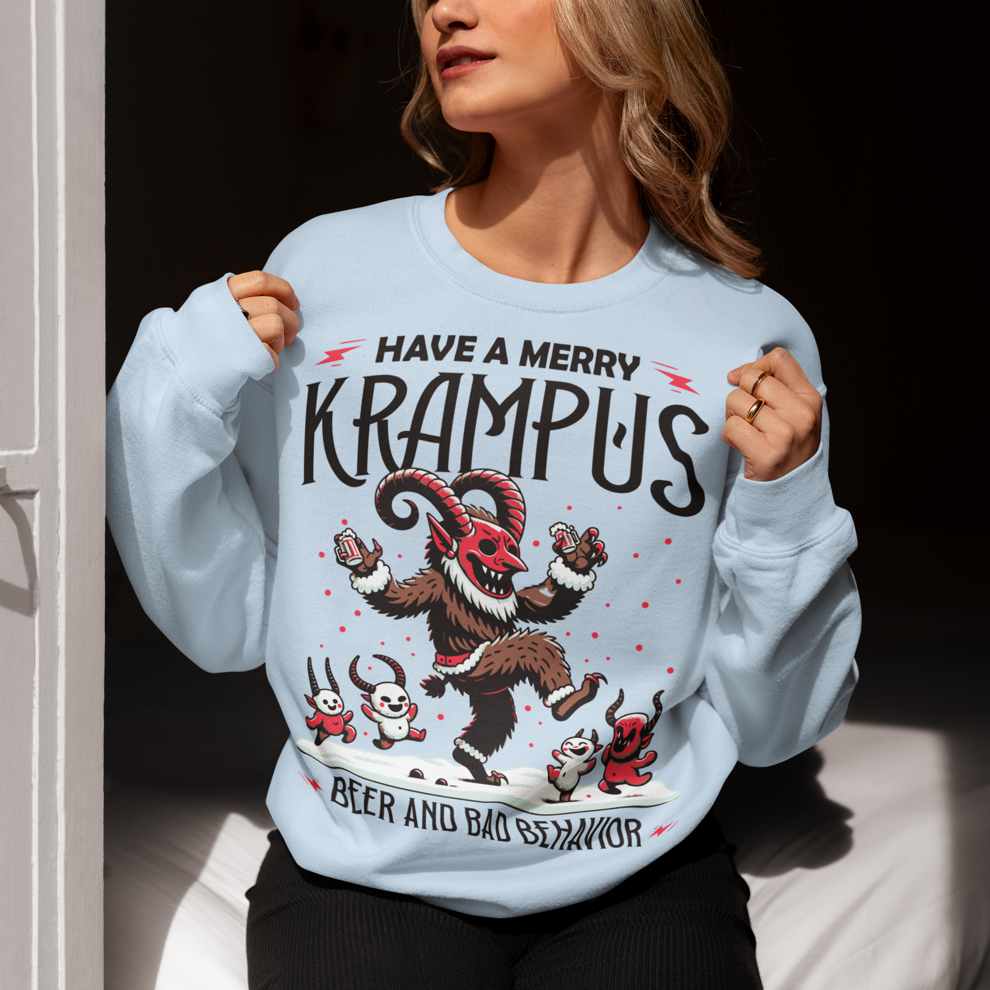 Light Blue sweatshirt of Krampus partying at Christmas and text "HAVE A MERRY KRAMPUS."