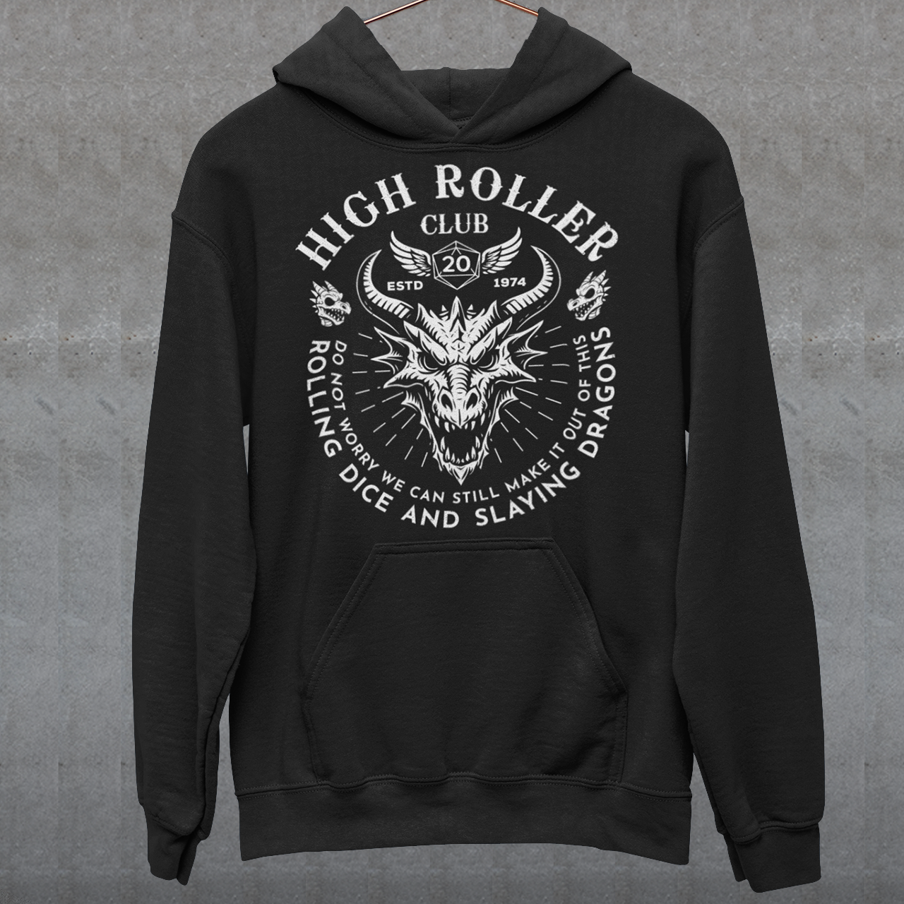 Step into legend status with the High Roller Club hoodie, forged for dice slingers, dragon slayers, and tabletop tacticians who play big and roll fearless. Featuring a fierce dragon crest and bold D20 iconography, this design salutes those who know fortune favors the bold and sometimes the wildly unprepared. Cozy enough for late night campaigns and intimidating enough for the gaming table, it’s built for crits, curses, and clutch saves alike.