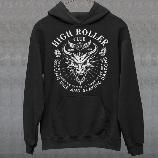 Step into legend status with the High Roller Club hoodie, forged for dice slingers, dragon slayers, and tabletop tacticians who play big and roll fearless. Featuring a fierce dragon crest and bold D20 iconography, this design salutes those who know fortune favors the bold and sometimes the wildly unprepared. Cozy enough for late night campaigns and intimidating enough for the gaming table, it’s built for crits, curses, and clutch saves alike.