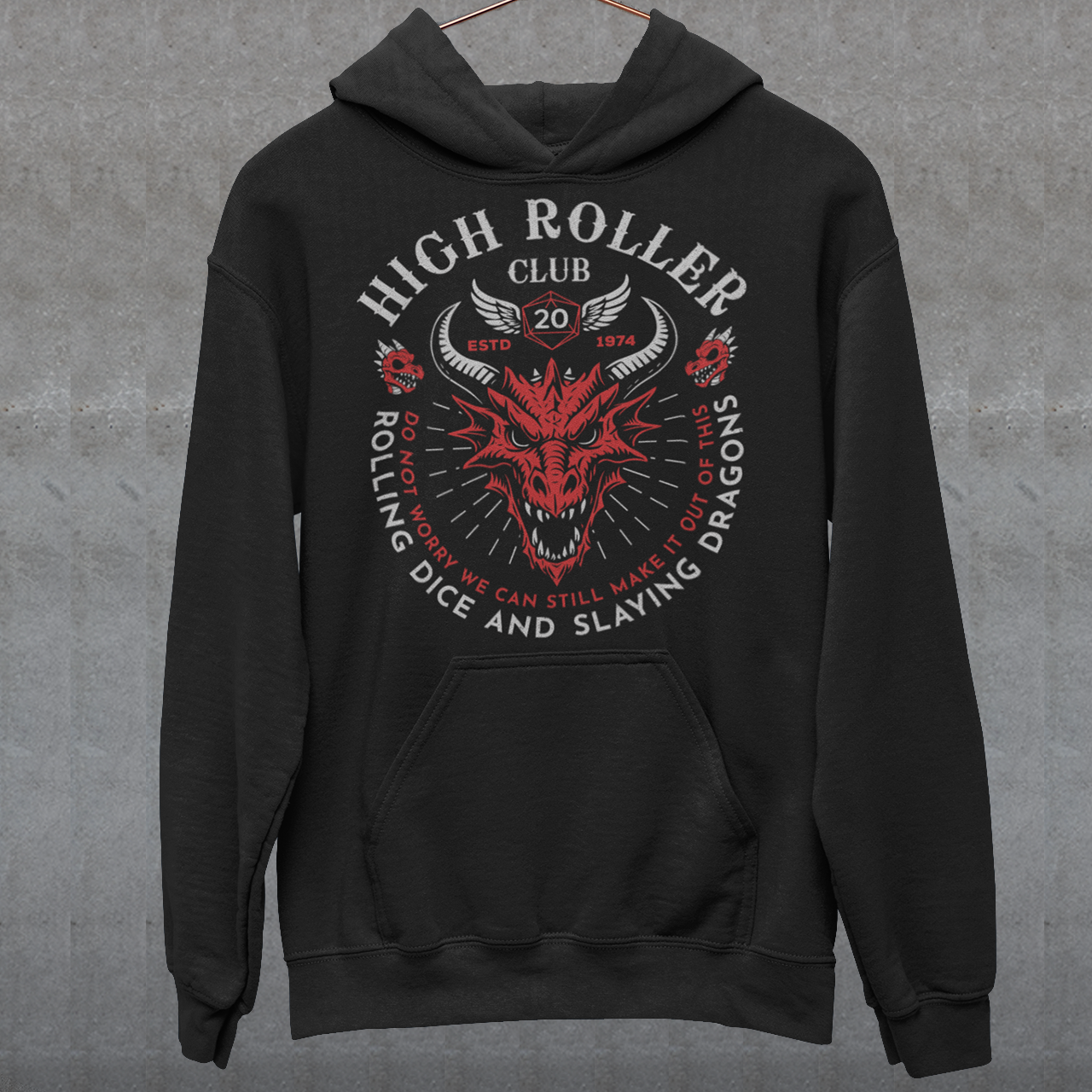 Step into legend status with the High Roller Club hoodie, forged for dice slingers, dragon slayers, and tabletop tacticians who play big and roll fearless. Featuring a fierce dragon crest and bold D20 iconography, this design salutes those who know fortune favors the bold and sometimes the wildly unprepared. Cozy enough for late night campaigns and intimidating enough for the gaming table, it’s built for crits, curses, and clutch saves alike.