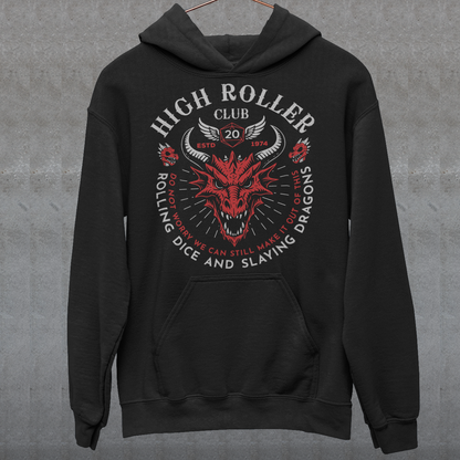 Step into legend status with the High Roller Club hoodie, forged for dice slingers, dragon slayers, and tabletop tacticians who play big and roll fearless. Featuring a fierce dragon crest and bold D20 iconography, this design salutes those who know fortune favors the bold and sometimes the wildly unprepared. Cozy enough for late night campaigns and intimidating enough for the gaming table, it’s built for crits, curses, and clutch saves alike.