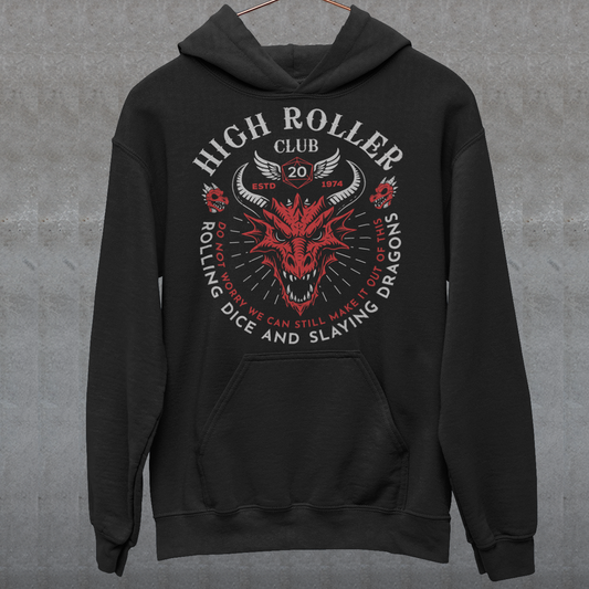 Step into legend status with the High Roller Club hoodie, forged for dice slingers, dragon slayers, and tabletop tacticians who play big and roll fearless. Featuring a fierce dragon crest and bold D20 iconography, this design salutes those who know fortune favors the bold and sometimes the wildly unprepared. Cozy enough for late night campaigns and intimidating enough for the gaming table, it’s built for crits, curses, and clutch saves alike.
