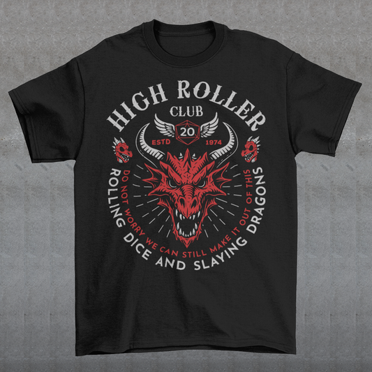 Step into legend status with the High Roller Club t-shirt, forged for dice slingers, dragon slayers, and tabletop tacticians who play big and roll fearless. Featuring a fierce dragon crest and bold D20 iconography, this design salutes those who know fortune favors the bold and sometimes the wildly unprepared. Cozy enough for late night campaigns and intimidating enough for the gaming table, it’s built for crits, curses, and clutch saves alike. Whether you’re a dungeon master pulling strings or a player chas