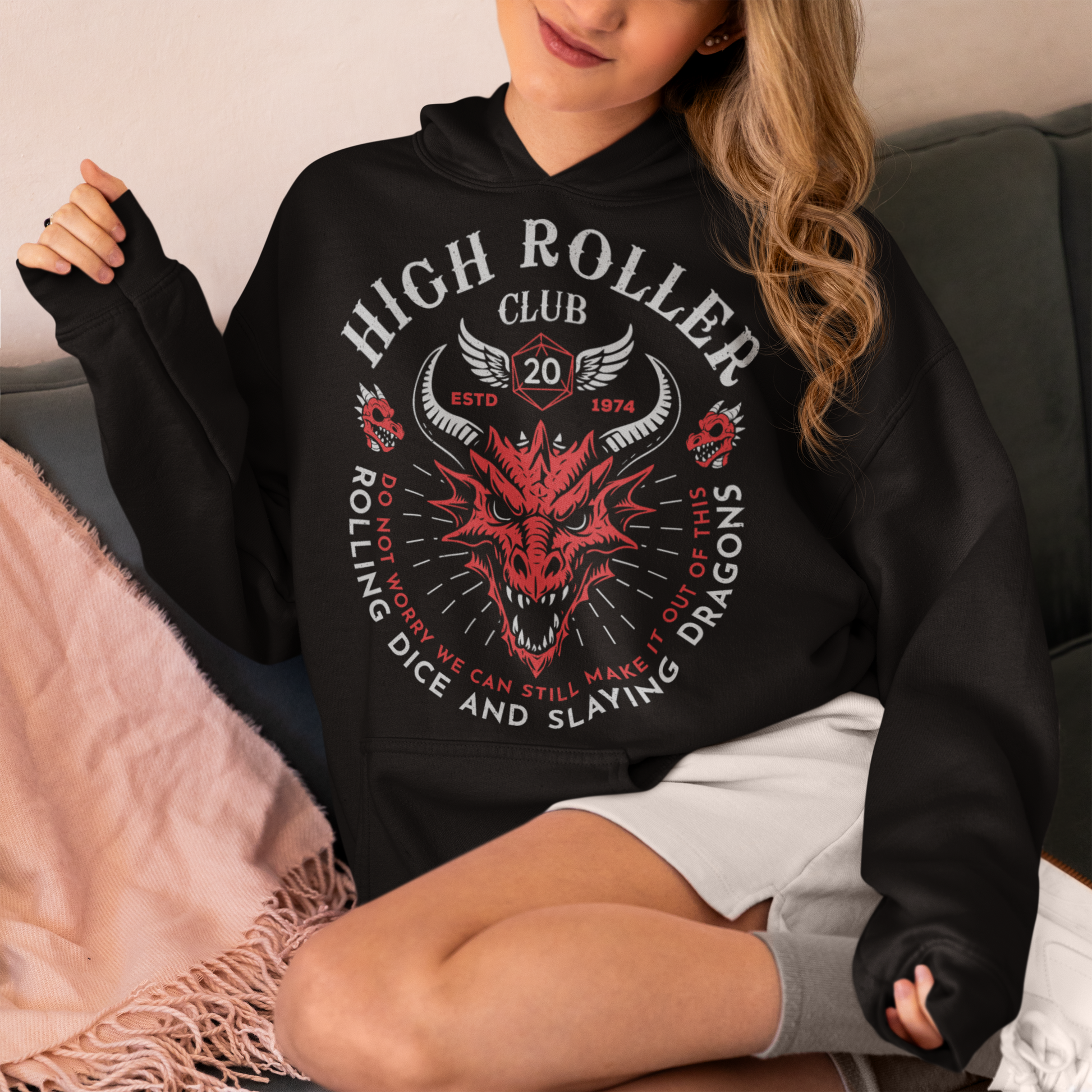 Step into legend status with the High Roller Club hoodie, forged for dice slingers, dragon slayers, and tabletop tacticians who play big and roll fearless. Featuring a fierce dragon crest and bold D20 iconography, this design salutes those who know fortune favors the bold and sometimes the wildly unprepared. Cozy enough for late night campaigns and intimidating enough for the gaming table, it’s built for crits, curses, and clutch saves alike.