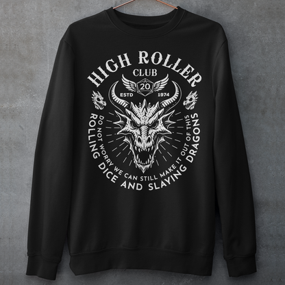 Step into legend status with the High Roller Club sweatshirt, forged for dice slingers, dragon slayers, and tabletop tacticians who play big and roll fearless. Featuring a fierce dragon crest and bold D20 iconography, this design salutes those who know fortune favors the bold and sometimes the wildly unprepared. Cozy enough for late night campaigns and intimidating enough for the gaming table, it’s built for crits, curses, and clutch saves alike. 