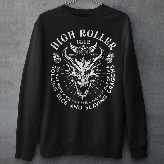 Step into legend status with the High Roller Club sweatshirt, forged for dice slingers, dragon slayers, and tabletop tacticians who play big and roll fearless. Featuring a fierce dragon crest and bold D20 iconography, this design salutes those who know fortune favors the bold and sometimes the wildly unprepared. Cozy enough for late night campaigns and intimidating enough for the gaming table, it’s built for crits, curses, and clutch saves alike. 