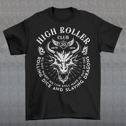 Step into legend status with the High Roller Club t-shirt, forged for dice slingers, dragon slayers, and tabletop tacticians who play big and roll fearless. Featuring a fierce dragon crest and bold D20 iconography, this design salutes those who know fortune favors the bold and sometimes the wildly unprepared. Cozy enough for late night campaigns and intimidating enough for the gaming table, it’s built for crits, curses, and clutch saves alike. Whether you’re a dungeon master pulling strings or a player chas