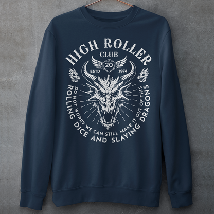 Step into legend status with the High Roller Club sweatshirt, forged for dice slingers, dragon slayers, and tabletop tacticians who play big and roll fearless. Featuring a fierce dragon crest and bold D20 iconography, this design salutes those who know fortune favors the bold and sometimes the wildly unprepared. Cozy enough for late night campaigns and intimidating enough for the gaming table, it’s built for crits, curses, and clutch saves alike. 