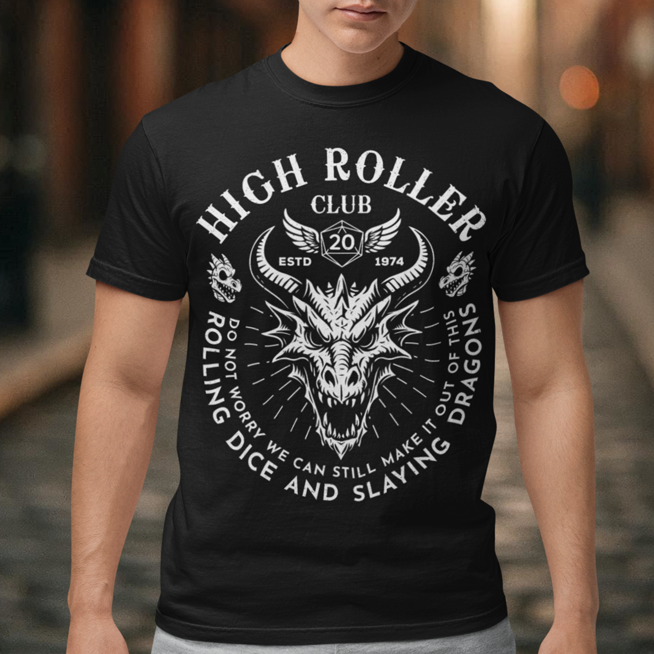Step into legend status with the High Roller Club t-shirt, forged for dice slingers, dragon slayers, and tabletop tacticians who play big and roll fearless. Featuring a fierce dragon crest and bold D20 iconography, this design salutes those who know fortune favors the bold and sometimes the wildly unprepared. Cozy enough for late night campaigns and intimidating enough for the gaming table, it’s built for crits, curses, and clutch saves alike.