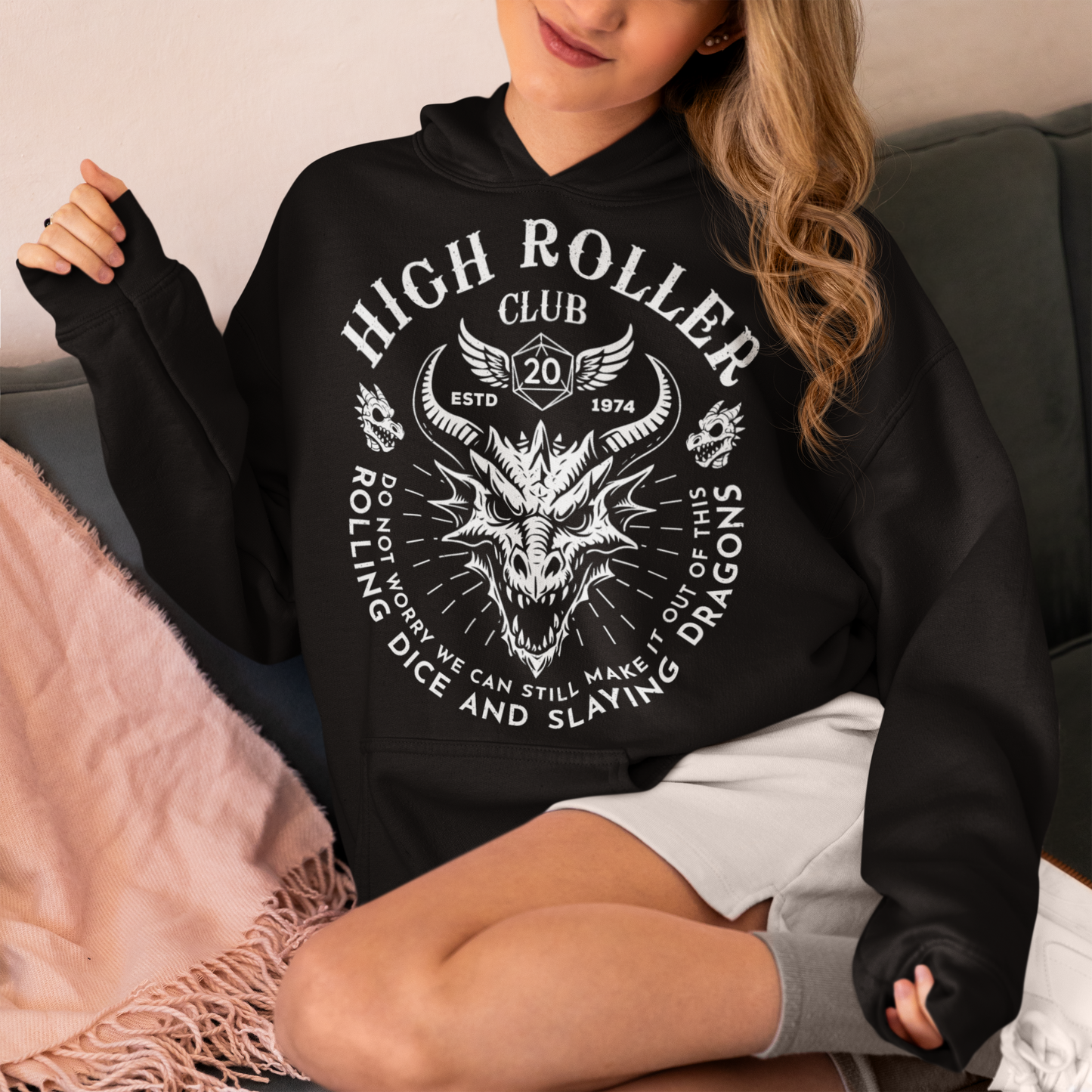 Step into legend status with the High Roller Club hoodie, forged for dice slingers, dragon slayers, and tabletop tacticians who play big and roll fearless. Featuring a fierce dragon crest and bold D20 iconography, this design salutes those who know fortune favors the bold and sometimes the wildly unprepared. Cozy enough for late night campaigns and intimidating enough for the gaming table, it’s built for crits, curses, and clutch saves alike.