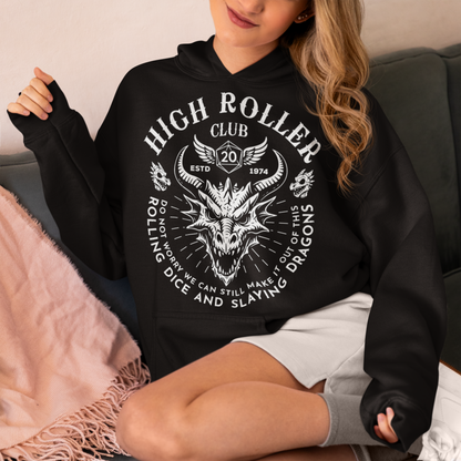 Step into legend status with the High Roller Club hoodie, forged for dice slingers, dragon slayers, and tabletop tacticians who play big and roll fearless. Featuring a fierce dragon crest and bold D20 iconography, this design salutes those who know fortune favors the bold and sometimes the wildly unprepared. Cozy enough for late night campaigns and intimidating enough for the gaming table, it’s built for crits, curses, and clutch saves alike.