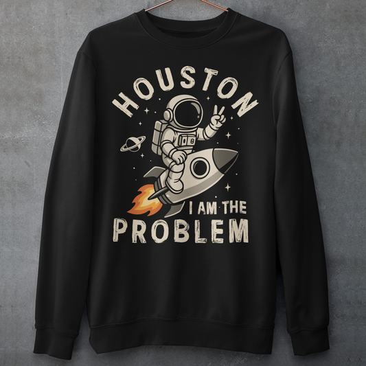 Make a statement that’s out of this world. This bold graphic sweatshirt features a fearless astronaut riding a rocket through space, throwing up a peace sign with cosmic confidence. Surrounding the design is the rebellious text: “HOUSTON I AM THE PROBLEM” — a playful twist on the classic space phrase. Perfect for space enthusiasts, rebels at heart, or anyone who loves a little cosmic humor.