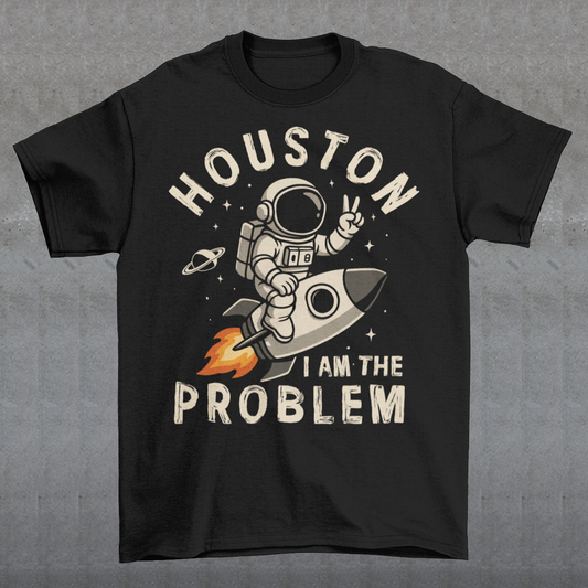 Make a statement that’s out of this world. This bold graphic tee features a fearless astronaut riding a rocket through space, throwing up a peace sign with cosmic confidence. Surrounding the design is the rebellious text: “HOUSTON I AM THE PROBLEM” — a playful twist on the classic space phrase. Perfect for space enthusiasts, rebels at heart, or anyone who loves a little cosmic humor.