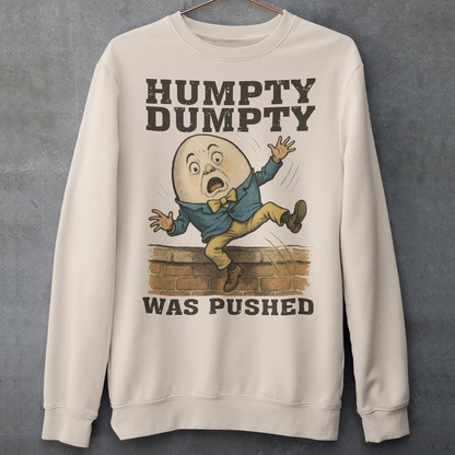Make a bold statement with our "Humpty Dumpty Was Pushed" Sweatshirt — a clever twist on the classic nursery rhyme. Featuring a playful yet rebellious design of Humpty Dumpty mid-fall from his iconic wall, this shirt mixes dark humor with nostalgic charm. Perfect for anyone who loves witty graphics, conspiracy-style humor, or just wants to spark a few laughs and double-takes.