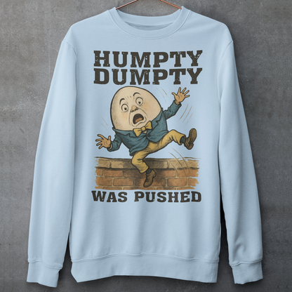 Make a bold statement with our "Humpty Dumpty Was Pushed" Sweatshirt — a clever twist on the classic nursery rhyme. Featuring a playful yet rebellious design of Humpty Dumpty mid-fall from his iconic wall, this shirt mixes dark humor with nostalgic charm. Perfect for anyone who loves witty graphics, conspiracy-style humor, or just wants to spark a few laughs and double-takes.