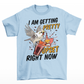 Light Blue t-shirt of cockatoo knocking over a cocktail with text underneath "I AM GETTING PRETTY UPSET RIGHT NOW".