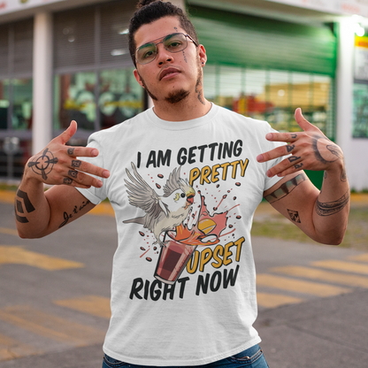 Introducing our whimsical and vibrant t-shirt featuring a mischievous cockatoo caught in a comical escapade. This design captures the playful spirit of this feathered troublemaker as it gleefully knocks over a meticulously crafted cocktail, sending colorful liquids splashing in all directions. The image perfectly portrays the unpredictable and endearing nature of these intelligent birds.