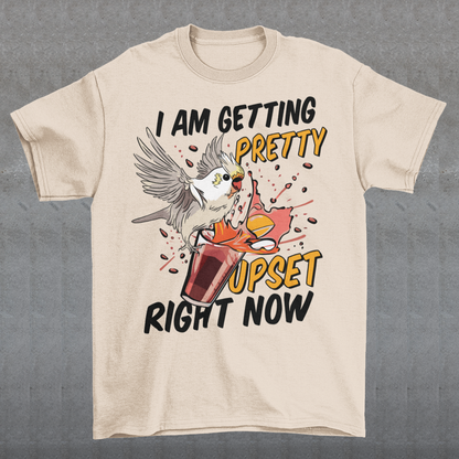 Introducing our whimsical and vibrant t-shirt featuring a mischievous cockatoo caught in a comical escapade. This design captures the playful spirit of this feathered troublemaker as it gleefully knocks over a meticulously crafted cocktail, sending colorful liquids splashing in all directions. The image perfectly portrays the unpredictable and endearing nature of these intelligent birds.