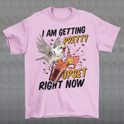 Introducing our whimsical and vibrant t-shirt featuring a mischievous cockatoo caught in a comical escapade. This design captures the playful spirit of this feathered troublemaker as it gleefully knocks over a meticulously crafted cocktail, sending colorful liquids splashing in all directions. The image perfectly portrays the unpredictable and endearing nature of these intelligent birds.