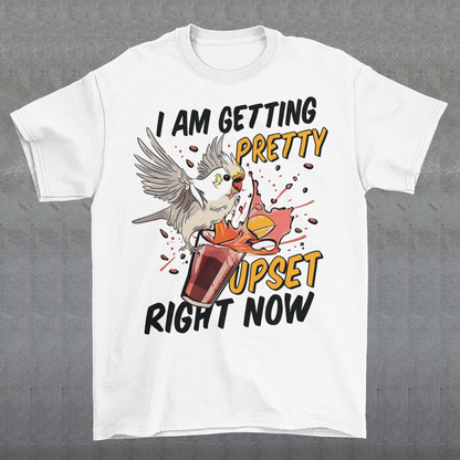 Introducing our whimsical and vibrant t-shirt featuring a mischievous cockatoo caught in a comical escapade. This design captures the playful spirit of this feathered troublemaker as it gleefully knocks over a meticulously crafted cocktail, sending colorful liquids splashing in all directions. The image perfectly portrays the unpredictable and endearing nature of these intelligent birds.