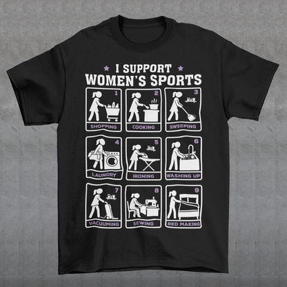 Black t-shirt featuring the humorous phrase “I SUPPORT WOMEN’S SPORTS” with nine illustrated panels parodying different household activities: shopping, cooking, sweeping, laundry, ironing, washing up, vacuuming, sewing, and bed making. White and purple graphics create a retro sports-style design with a sarcastic, tongue-in-cheek theme.