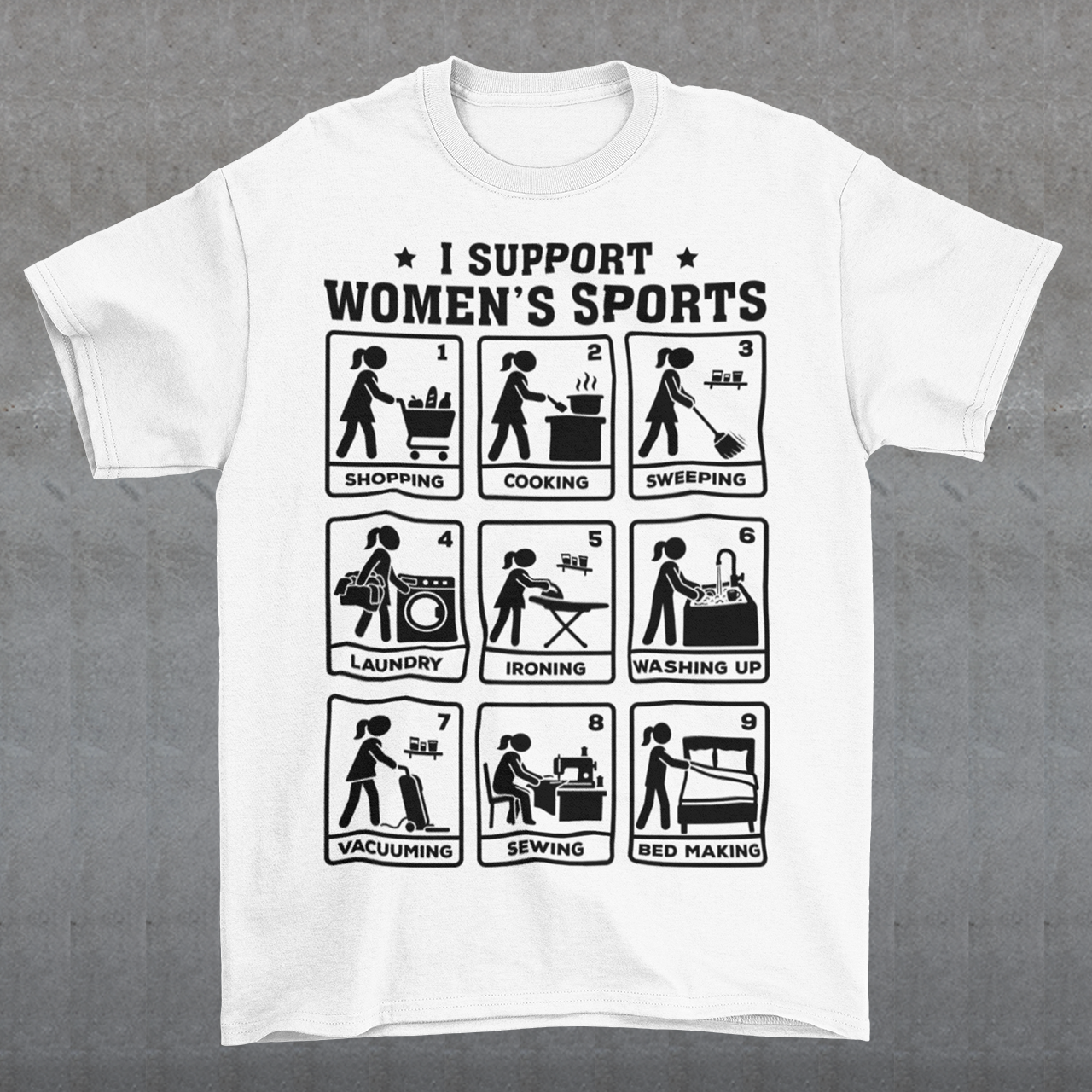 White t-shirt featuring the humorous phrase “I SUPPORT WOMEN’S SPORTS” with nine illustrated panels parodying different household activities: shopping, cooking, sweeping, laundry, ironing, washing up, vacuuming, sewing, and bed making. Black graphics create a retro sports-style design with a sarcastic, tongue-in-cheek theme.