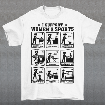 White t-shirt featuring the humorous phrase “I SUPPORT WOMEN’S SPORTS” with nine illustrated panels parodying different household activities: shopping, cooking, sweeping, laundry, ironing, washing up, vacuuming, sewing, and bed making. Black graphics create a retro sports-style design with a sarcastic, tongue-in-cheek theme.