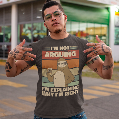 Brown t-shirt of a sloth holding a beer with a retro sun background with text  "I'M NOT ARGUING I'M JUST EXPLAINING WHY I'M RIGHT".