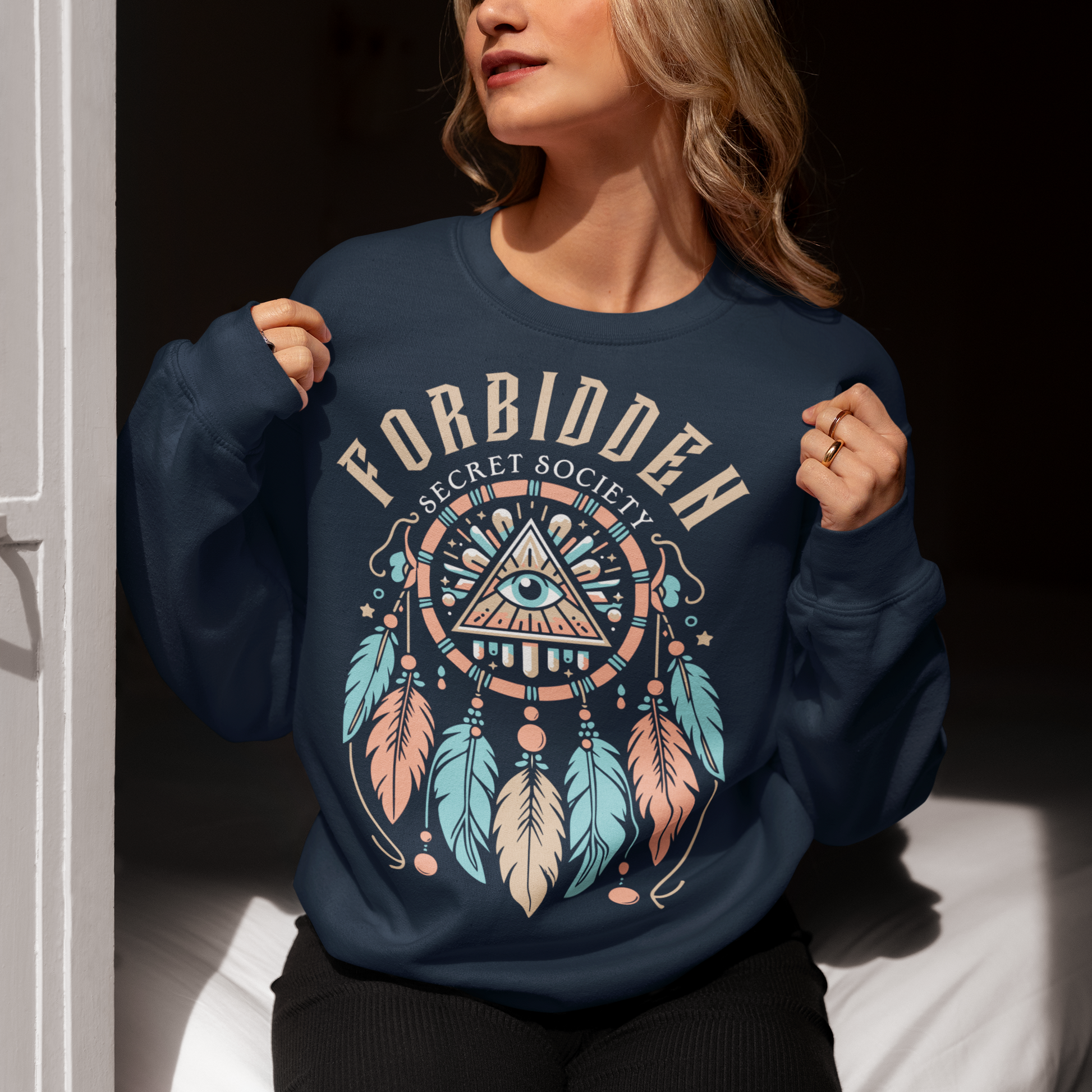 Navy sweatshirt of an Illuminati dreamcatcher with text FORBIDDEN SECRET SOCIETY.