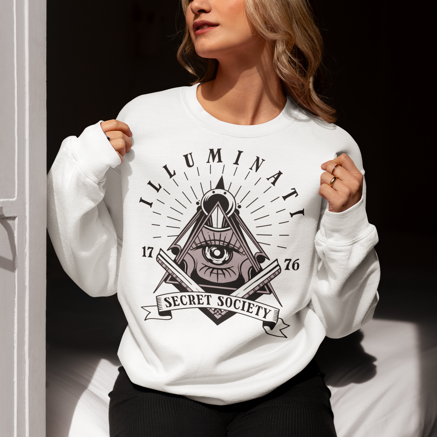 White sweatshirt with a free mason symbol and text Illuminati Secret Society.