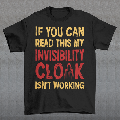 Turn heads and raise a few laughs with this clever and quirky tee! Featuring the bold text “IF YOU CAN READ THIS MY INVISIBILITY CLOAK ISN'T WORKING”, this shirt is perfect for wizards, pranksters, and introverts alike. Whether you're a fan of fantasy, sarcasm, or just enjoy flying under the radar, this shirt delivers a magical dose of humor.