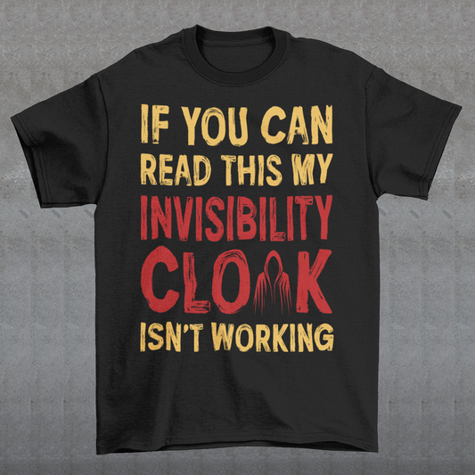 Turn heads and raise a few laughs with this clever and quirky tee! Featuring the bold text “IF YOU CAN READ THIS MY INVISIBILITY CLOAK ISN'T WORKING”, this shirt is perfect for wizards, pranksters, and introverts alike. Whether you're a fan of fantasy, sarcasm, or just enjoy flying under the radar, this shirt delivers a magical dose of humor.