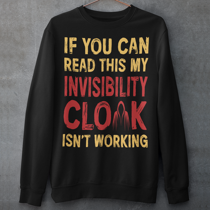 Turn heads and raise a few laughs with this clever and quirky sweatshirt! Featuring the bold text “IF YOU CAN READ THIS MY INVISIBILITY CLOAK ISN'T WORKING”, this shirt is perfect for wizards, pranksters, and introverts alike. Whether you're a fan of fantasy, sarcasm, or just enjoy flying under the radar, this shirt delivers a magical dose of humor.
