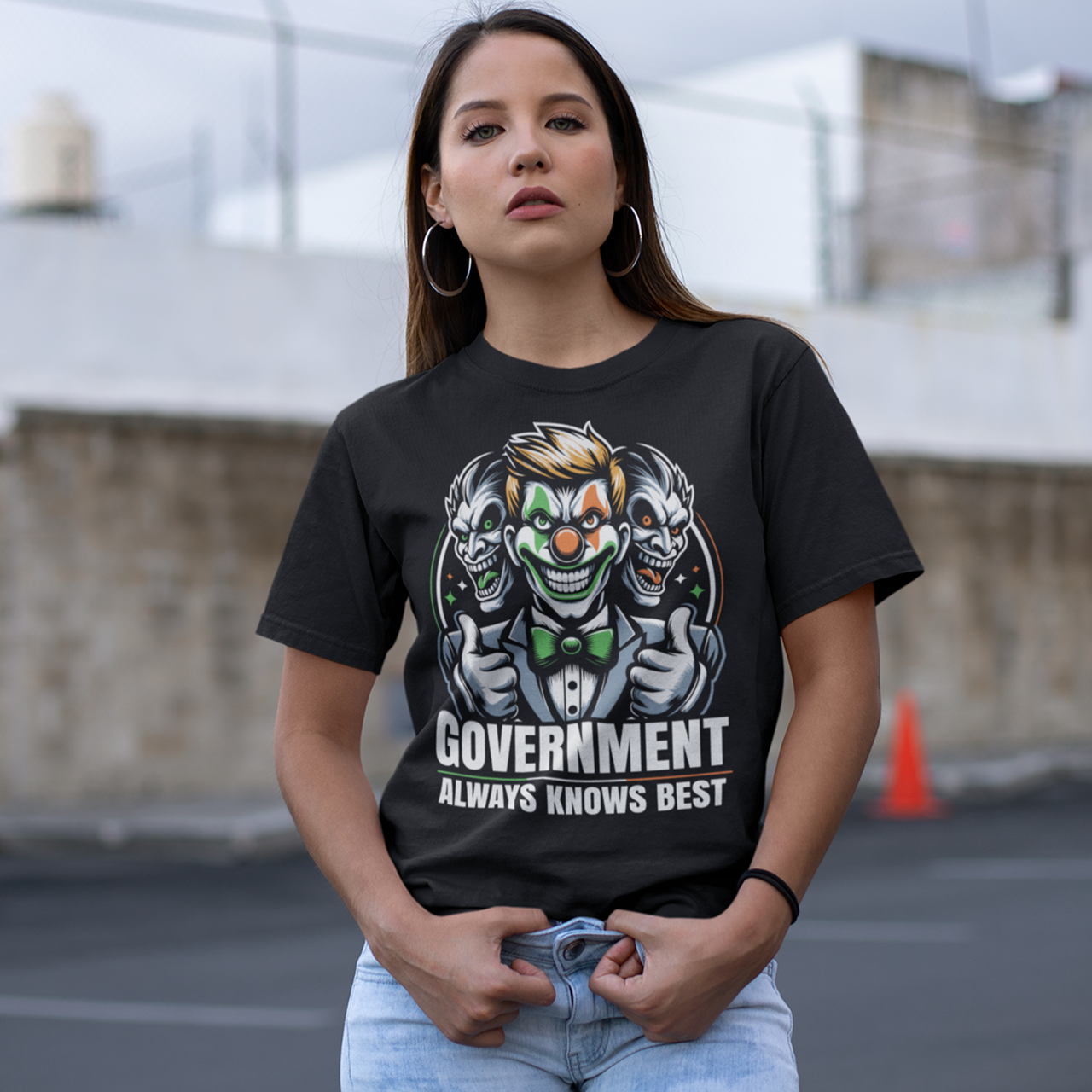 Black t-shirt of a government clown with text GOVERNMENT ALWAYS KNOWS BEST.