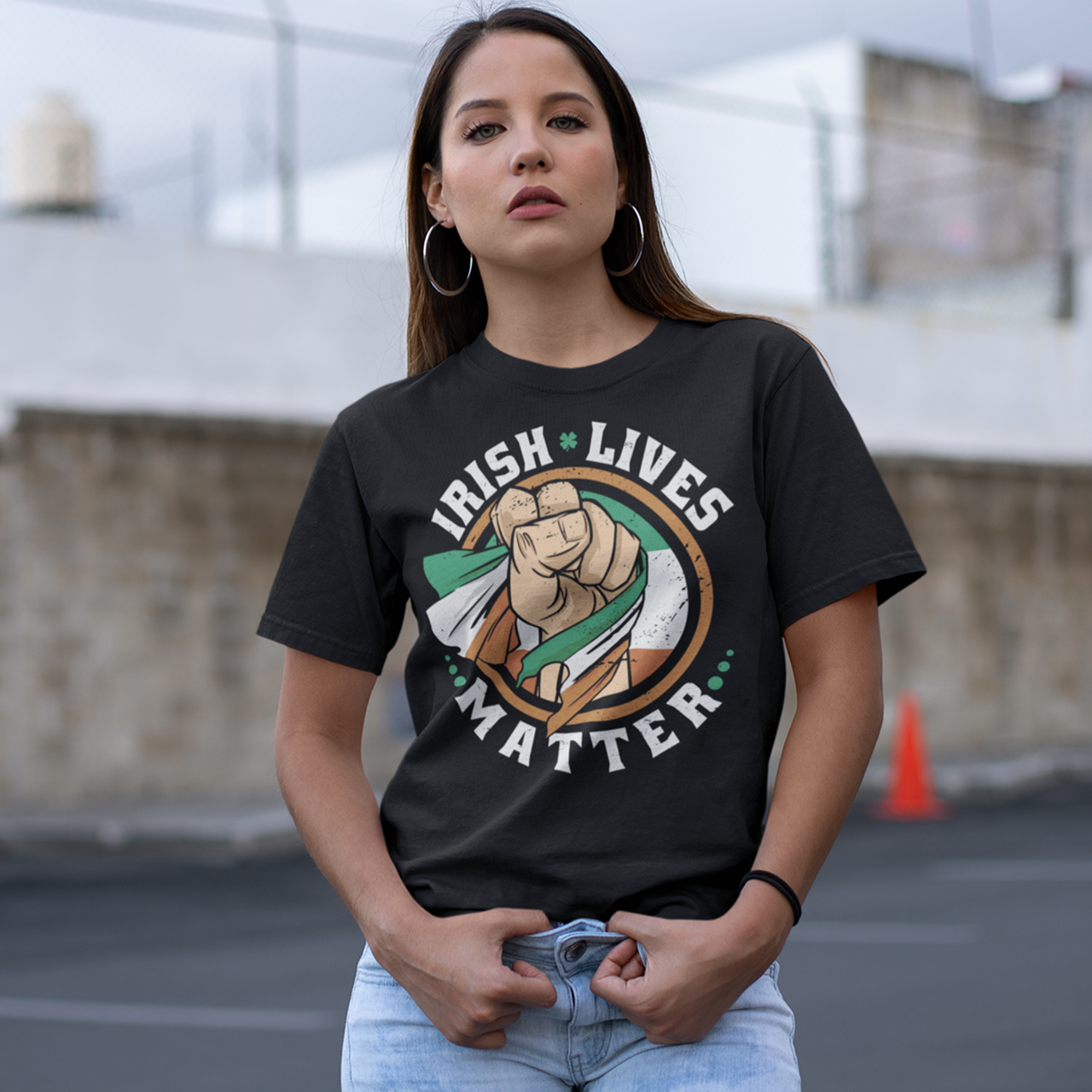 Black t-shirt of a fist holding an Irish flag with text  "IRISH LIVES MATTER".