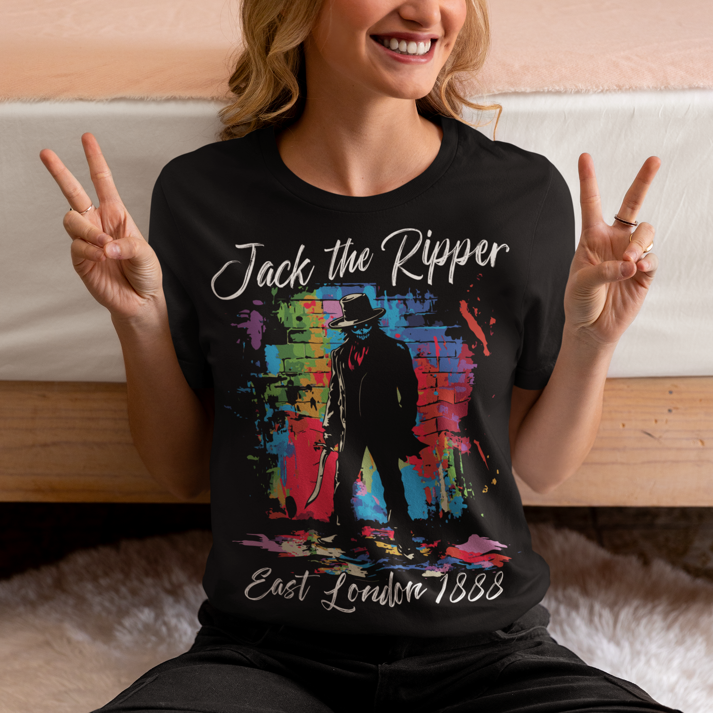 Black t-shirt of a graffiti Jack the Ripper design with text above "Jack the Ripper" and text below "East London 1888".