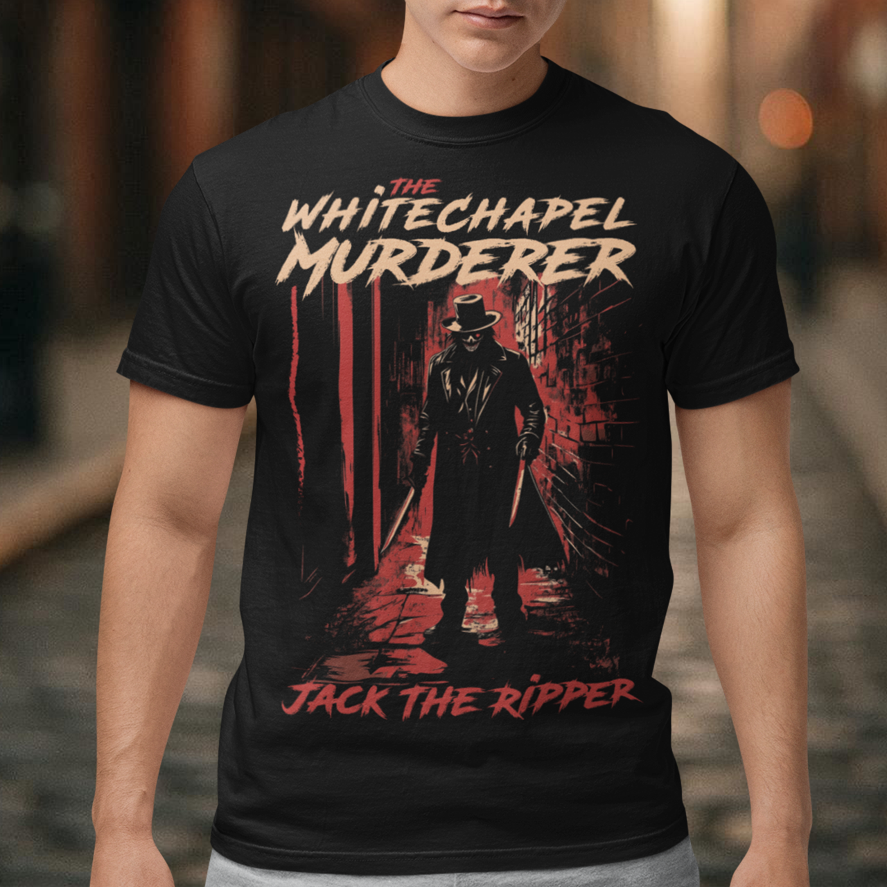 This striking design features Jack the Ripper standing ominously in a dark, fog-filled Victorian alley of Whitechapel. The figure is shadowed, cloaked in a long black coat and a top hat, with his face partially obscured, adding to the eerie mystery. The dim gas lamps cast a faint glow, highlighting the cobblestone street and the mist swirling around his feet. Above the artwork, bold, distressed text reads "THE WHITECHAPEL MURDERER", evoking the fear and infamy of the Ripper's legend.