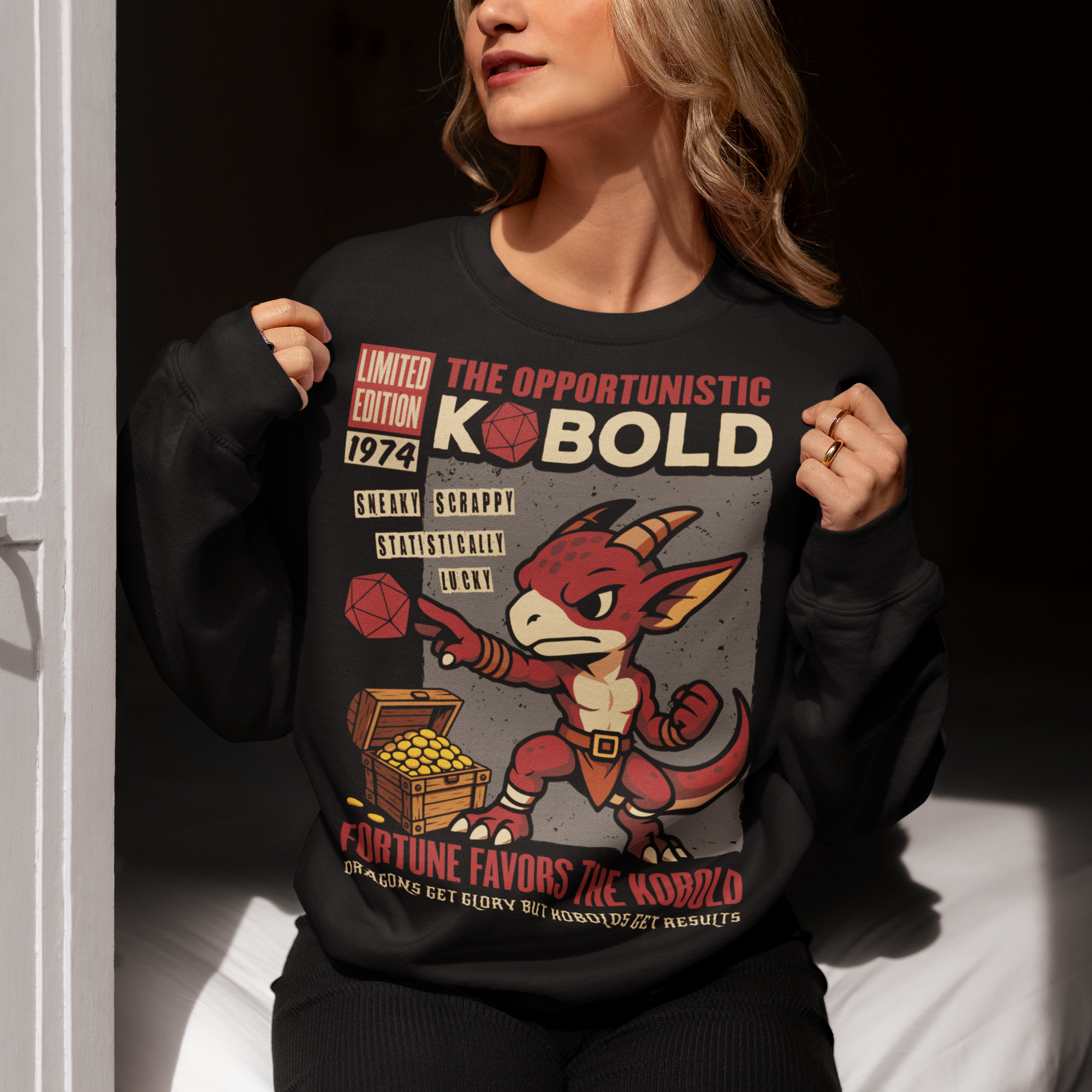Stay cozy while letting your inner dungeon schemer shine. This Kobold shirt features a bold retro comic-book style design with everyone’s favorite scrappy little dragonkin taking center stage. Dice in hand and treasure at his feet, this determined kobold proves that brains, teamwork, and a little bit of luck can turn even the smallest adventurer into a legend. Printed with a vintage tabletop RPG vibe, the artwork celebrates the chaotic charm of kobolds and the thrill of rolling for fortune.