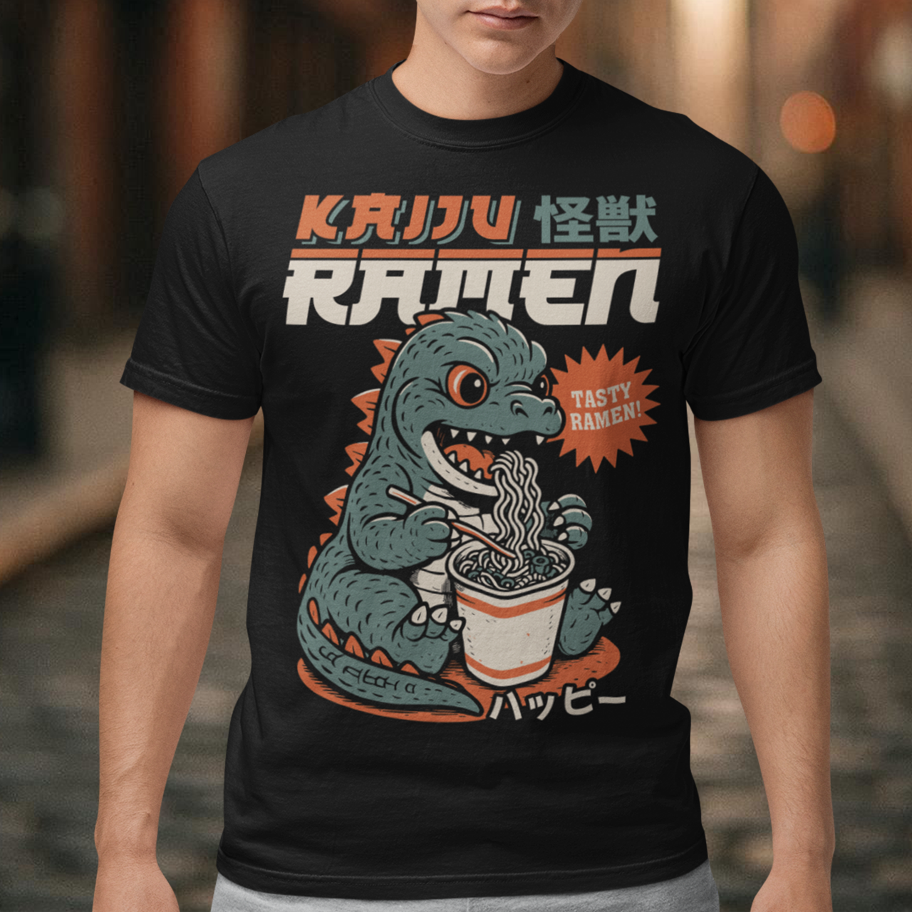 This epic tee features a towering Japanese monster (Kaiju) mid-slurp, devouring a massive bowl of ramen with wild abandon. With chopsticks in claw and noodles flying, it’s the ultimate mashup of monstrous hunger and culinary chaos. Bold text above reads KAIJU RAMEN, bringing Tokyo street-style energy to your wardrobe.
