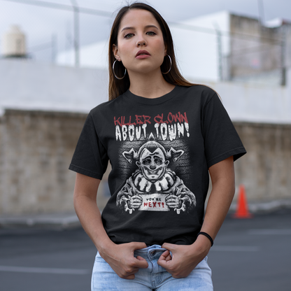 Black t-shirt with a killer clown holding a sign which reads YOU'RE NEXT with text above" KILLER CLOWN ABOUT TOWN".