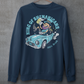 Navy sweatshirt with a leprechaun driving a car with text KING OF SHENANIGANS.