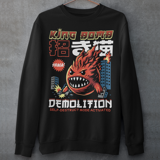 Unleash the chaos with our Japanese-style “King Bomb Demolition” Sweatshirt. Featuring a larger-than-life kaiju-inspired character, King Bomb towers over a crumbling cityscape in a striking manga/anime art style. Explosive details capture the raw energy of destruction as skyscrapers topple in his wake. Bold Japanese design elements bring an authentic streetwear vibe, while the text “KING BOMB DEMOLITION” adds a gritty punch to the artwork.