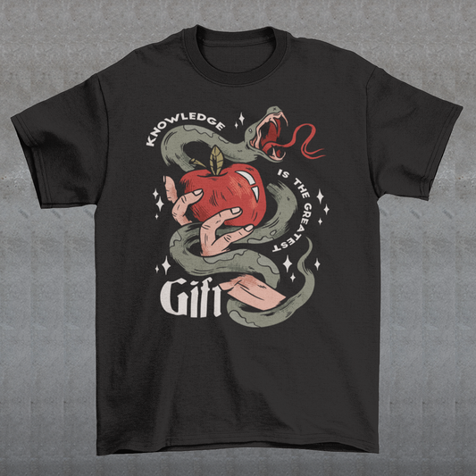 Introducing our captivating "Knowledge is the Greatest Gift" T-shirt – a design that seamlessly blends symbolism and style. Centered on the tee is a powerful image: a meticulously drawn hand cradling a luscious apple, artfully encased in the sinuous coils of a serpent. This iconic representation pays homage to the age-old biblical tale of Adam and Eve, where the apple, symbolizing knowledge, is intertwined with the cunning serpent.