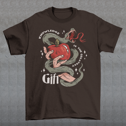Introducing our captivating "Knowledge is the Greatest Gift" T-shirt – a design that seamlessly blends symbolism and style. Centered on the tee is a powerful image: a meticulously drawn hand cradling a luscious apple, artfully encased in the sinuous coils of a serpent. This iconic representation pays homage to the age-old biblical tale of Adam and Eve, where the apple, symbolizing knowledge, is intertwined with the cunning serpent.