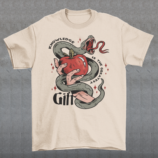 Introducing our captivating "Knowledge is the Greatest Gift" T-shirt – a design that seamlessly blends symbolism and style. Centered on the tee is a powerful image: a meticulously drawn hand cradling a luscious apple, artfully encased in the sinuous coils of a serpent. This iconic representation pays homage to the age-old biblical tale of Adam and Eve, where the apple, symbolizing knowledge, is intertwined with the cunning serpent.