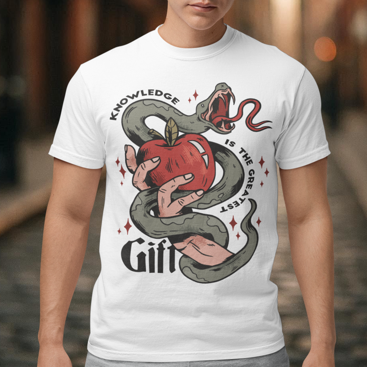 Introducing our captivating "Knowledge is the Greatest Gift" T-shirt – a design that seamlessly blends symbolism and style. Centered on the tee is a powerful image: a meticulously drawn hand cradling a luscious apple, artfully encased in the sinuous coils of a serpent. This iconic representation pays homage to the age-old biblical tale of Adam and Eve, where the apple, symbolizing knowledge, is intertwined with the cunning serpent.