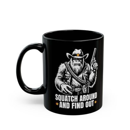 Black mug of a sheriff Sasquatch in the wild west holding a gun with text underneath SQUATCH AROUND AND FIND OUT.