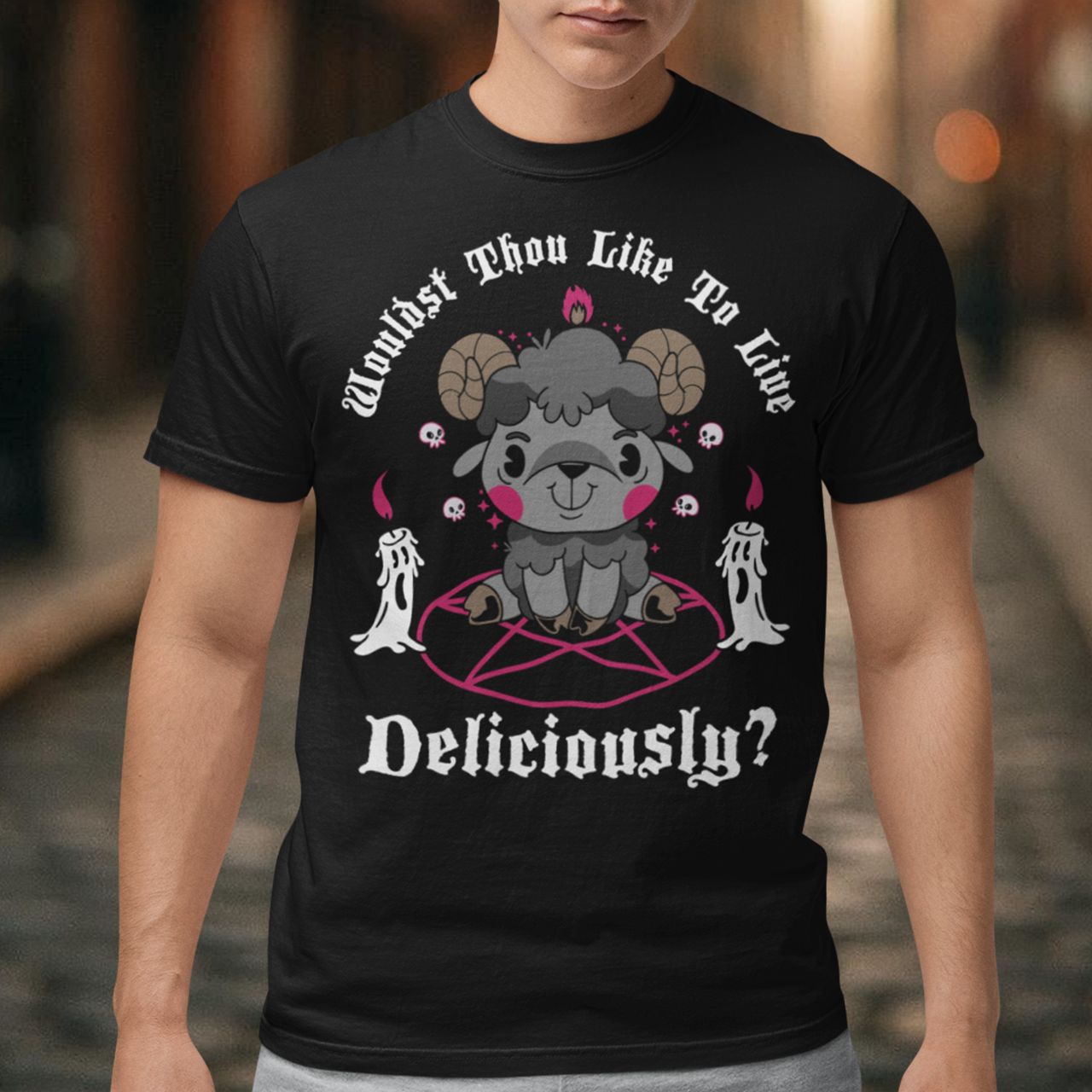 Unleash your inner rebel with this striking graphic tee featuring a smug, mystical goat perched atop a pentagram—summoning vibes as bold as your wardrobe. Inspired by folklore and a hint of witchy sarcasm, the chilling phrase "WOULDST THOU LIKE TO LIVE DELICIOUSLY?" is scrawled across the design in eerie, arcane lettering. Perfect for fans of the occult, dark humor, and aesthetic rebellion.