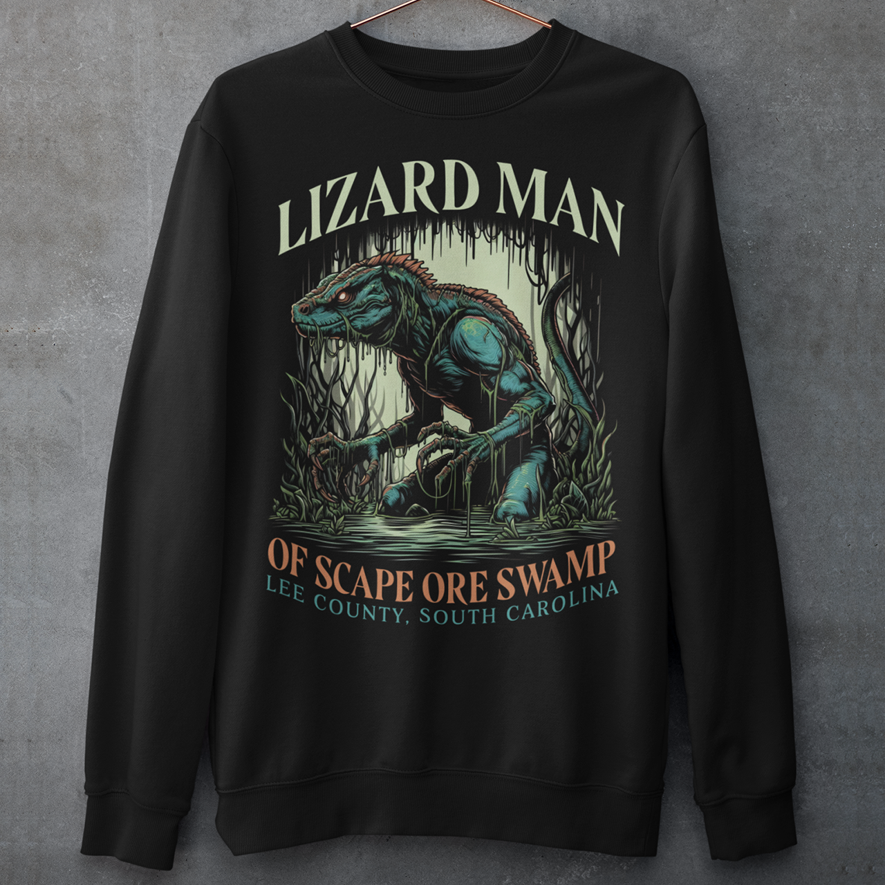 Black sweatshirt of a Lizard man in a swamp with text "LIZARD MAN OF SCAPE ORE SWAMP".