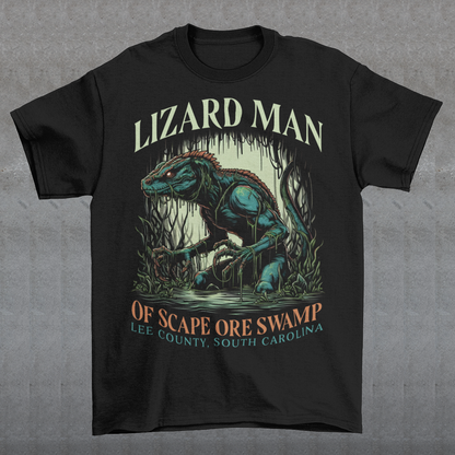 This t-shirt features a striking design of the legendary "Lizard Man of Scape Ore Swamp." The centerpiece is a menacing yet intriguing lizard man emerging from the murky depths of a swamp, with reptilian scales glistening under the eerie moonlight. The creature's glowing yellow eyes peer out from beneath a rugged brow, and its powerful claws grasp at the twisted roots and moss that surround it. Perfect for fans of cryptozoology, folklore, or anyone who loves a good monster tale!